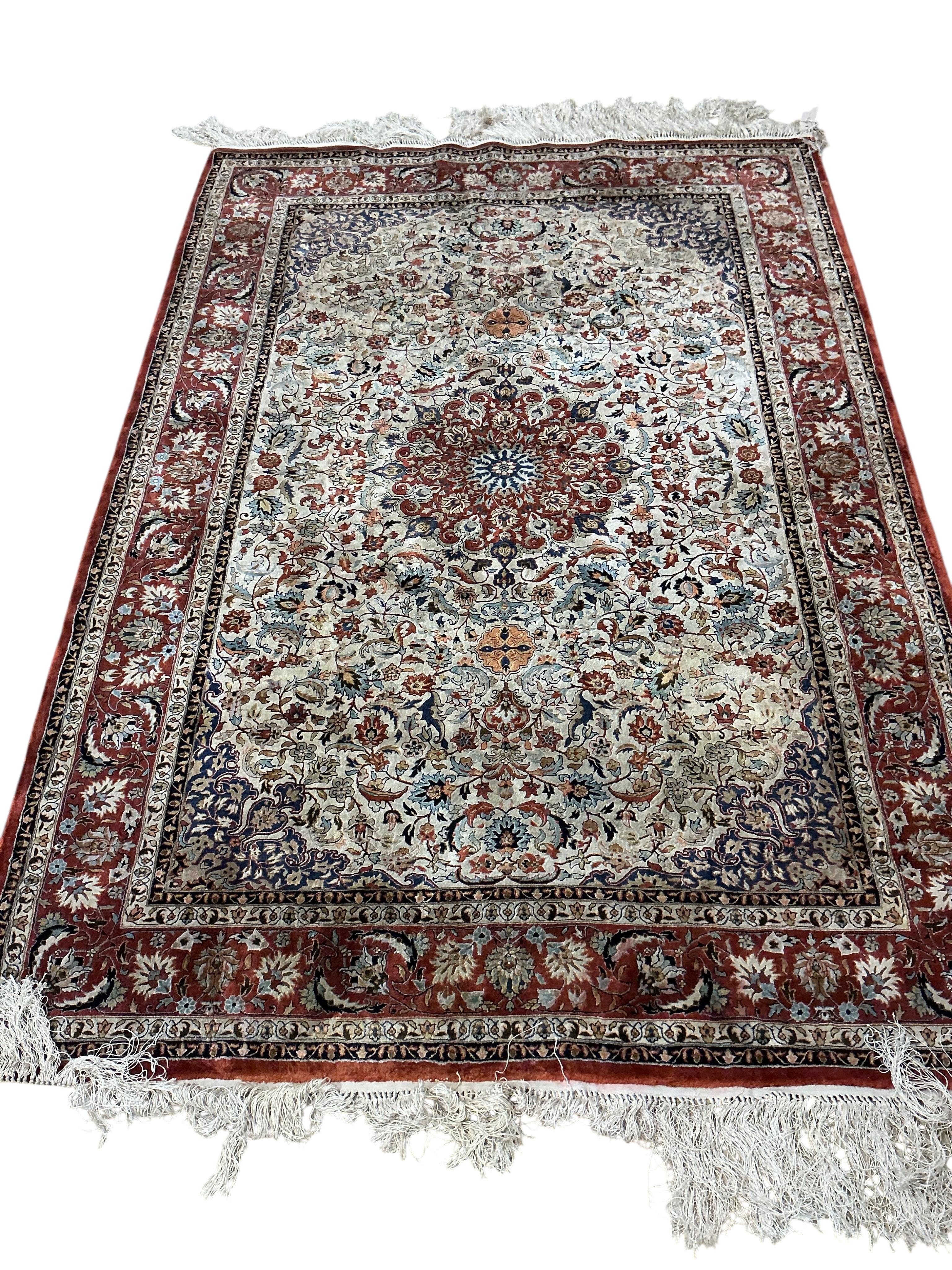 A North West Persian part silk ivory ground rug, 184 x 126cm